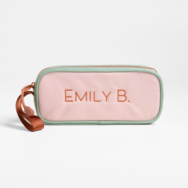 A fun pencil case that's built to handle all the thrills of the day. Colorblocked in candyfloss pink and mint green, the bag has a contrasting tawny brown zipper, zipper pull and loop handle for the perfect finish. Constructed of supremely durable polyester fabric that includes recycled plastic bottles, our roomy, easy-clean case makes it simple to keep all their pens and pencils organized and accessible. Pair with the Colorblock Pink and Mint Green lunch box and matching backpack for a totally Pink Bags With Pen Slots For Personal Use, Playful Pencil Case For Everyday Use, Back To School, Playful Pencil Case For Back To School, Pink Zipper Pouch Pencil Case, Trendy Zipper Pouch Stationery, Functional Pink Rectangular Pencil Case, Pink Rectangular Pencil Case For Daily Use, Pink Portable Rectangular Pencil Case, Pink Rectangular Pencil Case For School