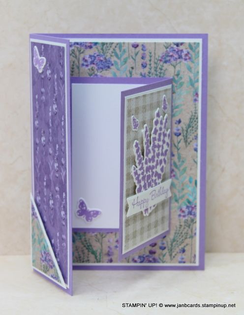 an open card with purple flowers and butterflies on it