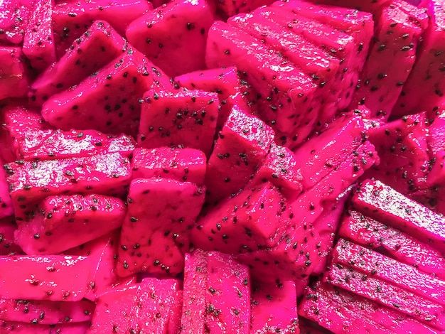 pink colored food with black dots on it stock photo