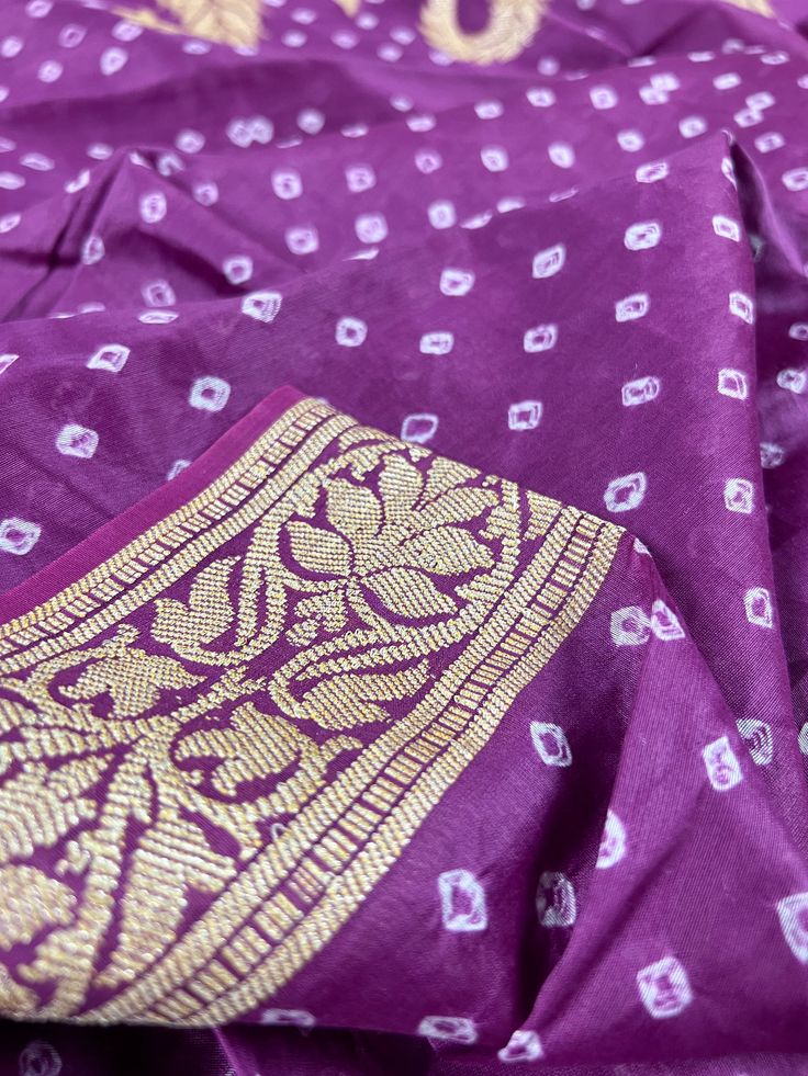 Handmade Semi Dupion Banarasi Silk Saree in Purple Color with Muted Gold Zari Weave Work. Please note - Color might look Light Purple in Sunlight and Dark Park in roomlight or dark light. Item : SareeBase Fabric : Semi Dupion Banarasi SilkColor : Purple Blouse piece : Comes with un-stitched Blouse piece.Blouse material : Dupion Banarasi SilkWork : HandwovenFall & Edging(Yes/No) : YesDisclaimer -:- Color variation is possible due to various reasons like phone or desktop setting, resolution etc. P Diwali Salwar Kameez With Bandhani Print For Traditional Ceremonies, Traditional Salwar Kameez In Banarasi Silk With Bandhani Print, Unstitched Bandhani Print Blouse Piece For Puja, Festive Unstitched Bandhani Blouse Piece, Unstitched Art Silk Bandhani Traditional Wear, Unstitched Art Silk Traditional Wear With Bandhani Print, Unstitched Bandhani Blouse Piece For Festive Occasions, Purple Art Silk Unstitched Suit For Festive Occasions, Chanderi Blouse Piece With Bandhani Print For Festivals