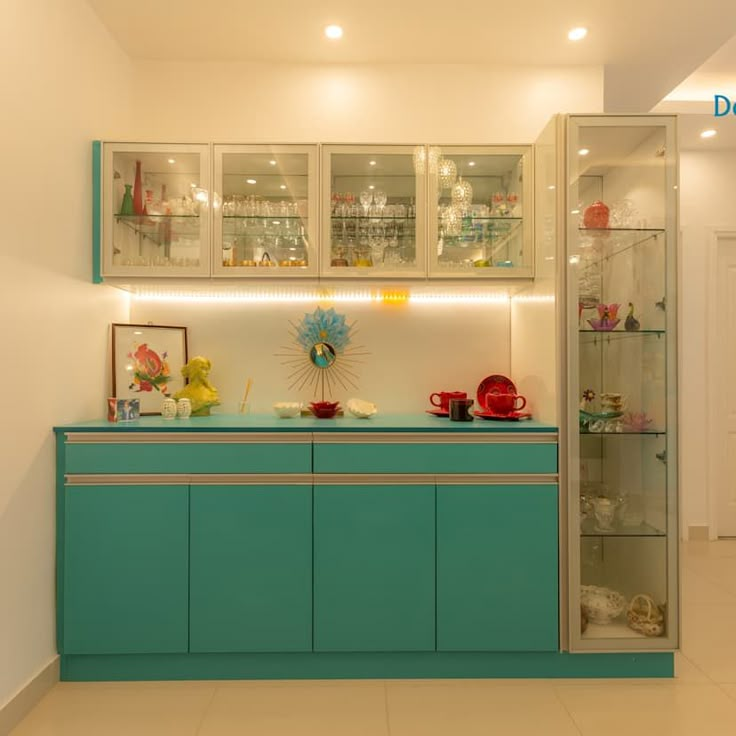 a blue cabinet with glass doors and shelves in a room that has white tiles on the floor