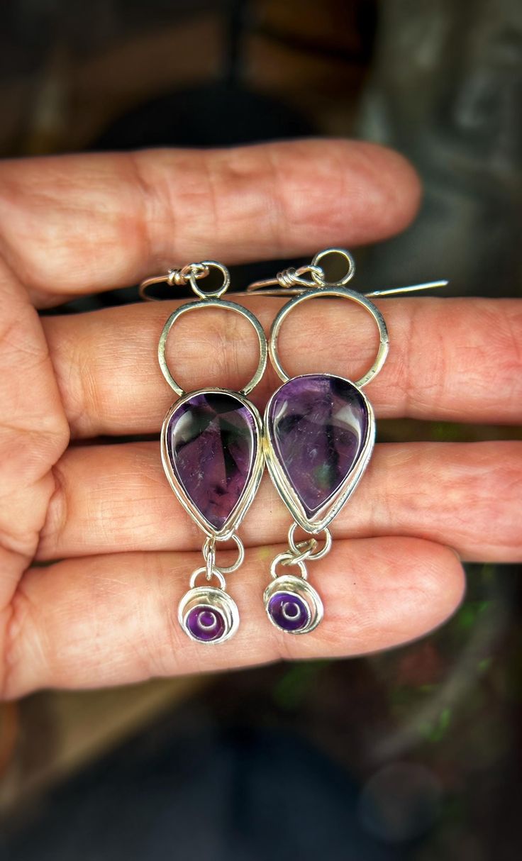 Theses beautiful purple amethyst stones are set in sterling silver. I got the stones from the Tucson gem fair. These are a one of a kind earrings. They are 2 1/2 inches long. Completely handcrafted with love by me in sunny Arizona. they are sterling silver French wire hooks Handmade Purple Sterling Silver Earrings, Purple Dangle Jewelry Stamped 925, Amethyst Dangle Earrings Stamped 925, Artisan Sterling Silver Purple Jewelry, Artisan Sterling Silver Jewelry In Purple, Nickel-free Amethyst Lavender Earrings, Artisan Purple Sterling Silver Jewelry, Purple Artisan Sterling Silver Jewelry, Nickel-free Lavender Amethyst Earrings