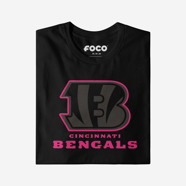 When your team shines bright, you should too! Get ready to glow on gameday with the Cincinnati Bengals Highlight Reel T-Shirt. Features All-over black and neon design: This t-shirt is dark with highlighted features so you can shine bright on gameday and everyday Team logo display with highlight outline: The front of this apparel features a black team logo display outlined in neon pink, and a neon pink wordmark team name display so you can show off your team spirit with pride Crew neck rib collar Logo Display, Neon Design, Team T Shirts, Black Neon, Team Name, Team Shirts, Cincinnati Bengals, National Football League, Team Names