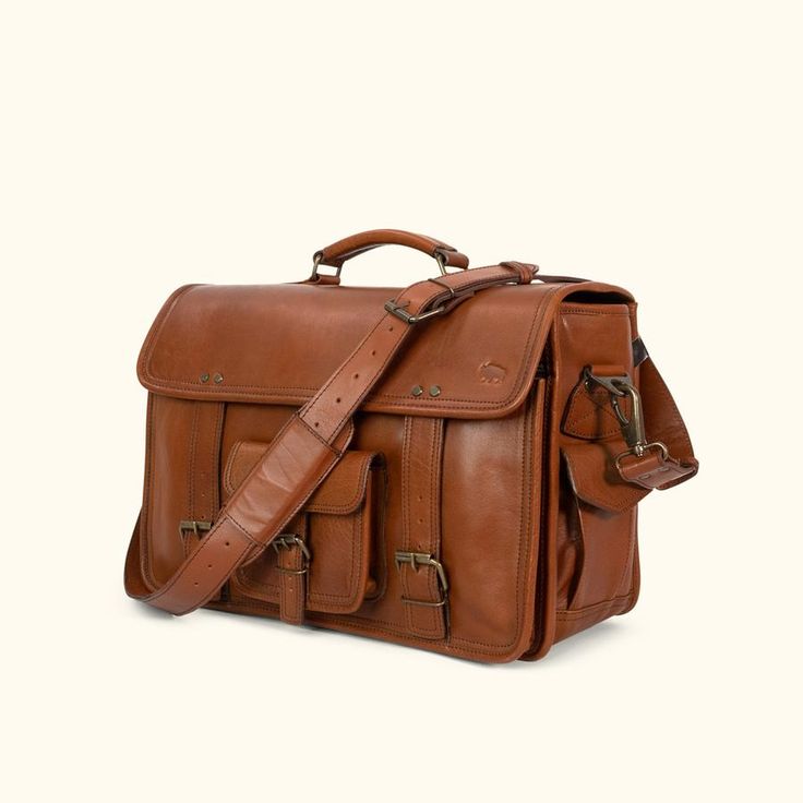 Large Travel Bag - Mens Leather Duffle Bag | Buffalo Jackson Classic Briefcase With Brass Hardware For Everyday, Classic Everyday Briefcase With Brass Hardware, Rectangular Travel Shoulder Bag With Brass Hardware, Satchel Briefcase With Brass Hardware, Rectangular Shoulder Bag With Brass Hardware For Travel, Classic Rectangular Travel Bag With Waxed Finish, Travel Satchel Briefcase With Brass Hardware, Leather Briefcase With Brass Hardware For Daily Use, Leather Shoulder Bag With Brass Hardware For Travel