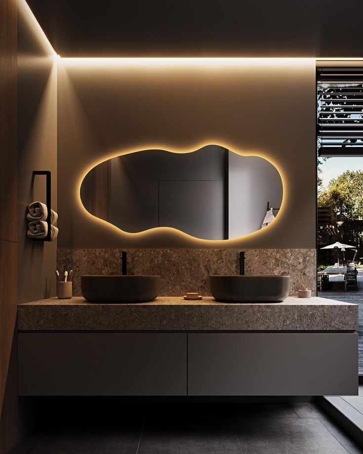 a bathroom with two sinks and a large mirror on the wall next to each other