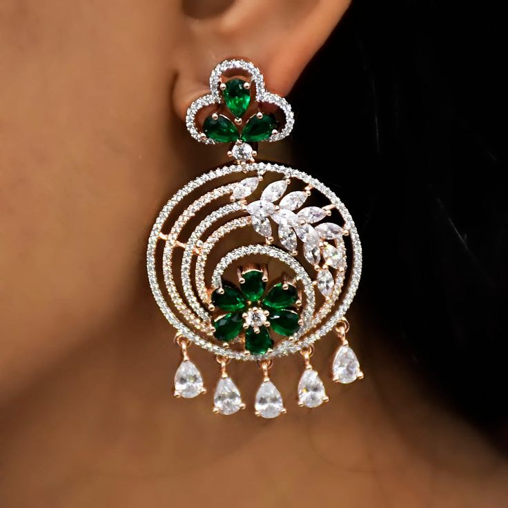 These are a beautiful pair of Earrings, made with semi-precious stones, and American diamonds. These earrings work well with all types of clothing, whether it be formal attire or a casual party. Eye-catching and unique jewellery that will set you apart. Gift this piece to a loved one, and see their face light up with joy. Best for gifting or for personal use, wear it to any occasion and be in the spotlight. Elegant Plug Earrings For Festive Celebration, Elegant Festive Celebration Plug Earrings, Elegant Green Chandbali Danglers, Elegant Festive Hoop Earrings, Elegant Festive Dangle Hoop Earrings, Fusion Style Hand Set Chandelier Earrings For Party, Elegant Chandbali Plug Earrings, Elegant Pierced Bridal Earrings For Festive Occasions, Elegant Gemstone Chandelier Earrings For Parties