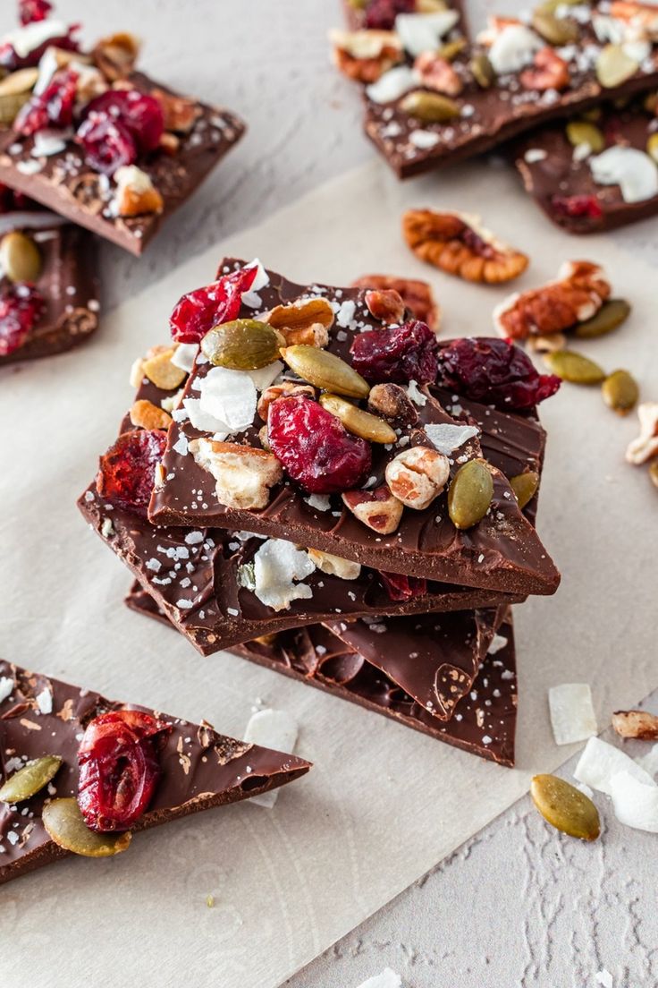 several pieces of chocolate with nuts and dried cherries