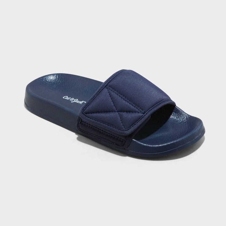 They'll be ready to take on anything with these Kris Sport Slide Sandals from Cat & Jack™. The slip-on slide sandals features a contoured footbed to keep their feet comfy for any occasion, while adjustable hook-and-loop strap provides a snug, secure fit. Your kiddo can wear these slide sandals with any style of outfits for versatile wear. Cat & Jack™: Kids’ clothing with an imagination of its own. Slip-resistant Synthetic Slide Sport Sandals, Sporty Foam Sandals For Summer, Casual Foam Slide Sandals, Navy Cushioned Open Toe Slides, Casual Non-slip Foam Sandals, Slip-resistant Foam Slip-on Sandals, Adjustable Non-slip Sport Slide Sandals, Slip-resistant Foam Sandals With Open Toe, Adjustable Non-slip Slide Sport Sandals