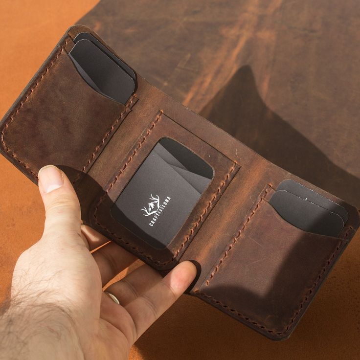 "Elevate your daily style with our Personalized Handmade Genuine Trifold Leather Wallet. Carefully crafted from premium full-grain leather, this wallet exudes luxury and sophistication. Quality Craftsmanship: Each wallet is meticulously handmade by skilled artisans, ensuring impeccable attention to detail and superior quality. From precise stitching to a smooth finish, every aspect of our wallet reflects expert craftsmanship. Functional Design: With multiple card slots, compartments for cash, an Leather Trifold Wallet With Coin Pocket For Everyday, Everyday Smooth Grain Trifold Wallet, Leather Trifold Wallet For Business, Luxury Trifold Wallet For Everyday Use, Luxury Everyday Trifold Wallet, Leather Trifold Wallet With Waxed Finish, Leather Trifold Wallet With Waxed Finish For Everyday Use, Luxury Leather Trifold Wallet, Leather Trifold Wallet With Rfid Blocking As Gift