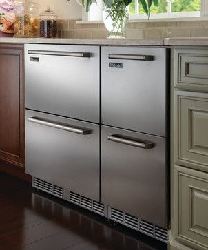 a kitchen scene with focus on the double doors and drawers that are open to let in natural light