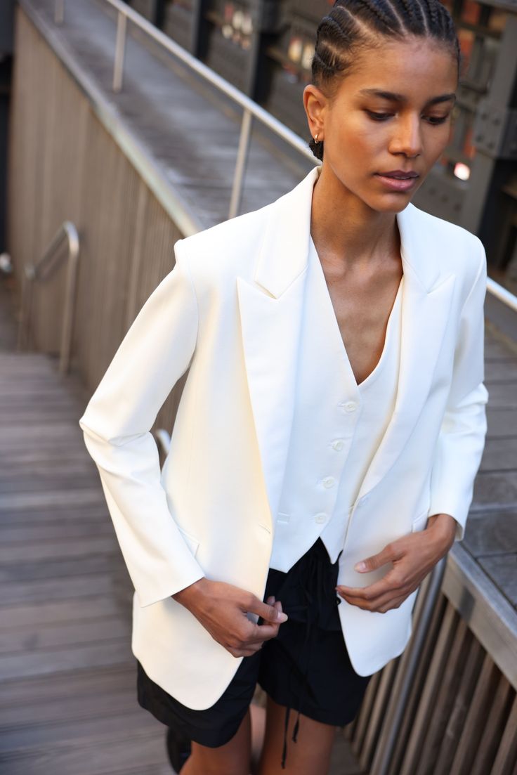 Your most versatile statement piece. Slightly oversized bright white tuxedo style blazer with white satin detailing for a subtle dressy touch. One-button front closure. Produced in NYC in Japanese-sourced fabric. SA’s Softly Suited collection: Menswear inspired suiting in feminine silhouettes and breathable, wearable f White Waistcoat, Classic Tuxedo, White Tuxedo, Tuxedo Blazer, Tuxedo Style, Style Blazer, Tuxedo Jacket, Pj Pants, Menswear Inspired