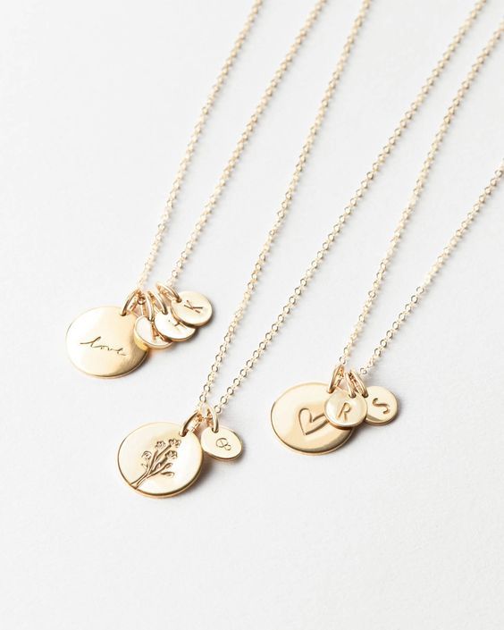 Tell a sparkling story with a symbolic disk paired with (up to five!) tiny initial tags — one for all your loves. Another reason to love this piece: you can add extra initial tags as your story grows! Delicate Everyday Charm Necklace With Initial Pendant, Delicate Everyday Charm Necklaces With Initial Pendant, Personalized Dainty Pendant Charm Necklace, Dainty Initial Necklace With Charms For Personalized Gift, Dainty Personalized Pendant Charm Necklaces, Dainty Personalized Pendant Charm Necklace, Dainty Charm Necklaces With Initial Pendant For Everyday, 14k Gold Filled Initials Necklace For Everyday, Personalized 14k Gold Necklace For Everyday