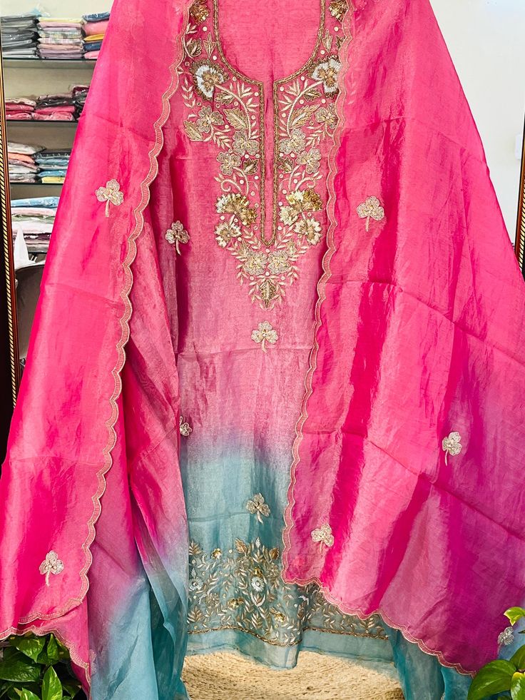 Item Overview ATHARVA HandWoven Pure Tissue Silk Salwar Kameez/Hand Embroidery/Ombré Tissue/Heirloom Worthy/Custom Stitch Unstitch/Anarkali/Plazzo Dno. SK2012 Fabric:  * Shirt: Pure Tissue Silk - Hand Embroidery/ 2.5 Mts Beautiful Aari Dori Work * Dupatta: Pure Tissue Silk - Hand Embroidery/ 2.5 Mts Beautiful Aari Dori Work/Elegant/Tassels/ * Bottom: Pure Tissue Silk 2.5 Mts. Excusive Hand Embroidered Party Wear Punjabi Suit. Customization: * Fabrics Customization: Designs Can be made in differe Resham Embroidered Raw Silk Palazzo Set For Celebration, Festive Unstitched Raw Silk Suit With Embroidered Border, Unstitched Raw Silk Suit With Dabka Work For Celebration, Pink Raw Silk Unstitched Suit With Dori Work, Celebration Unstitched Suit With Dabka Work On Raw Silk, Embroidered Tussar Silk Salwar Kameez For Navratri, Pink Dola Silk Unstitched Suit With Dori Work, Pink Tussar Silk Traditional Wear With Dori Work, Tussar Silk Salwar Kameez With Embroidered Border For Navratri