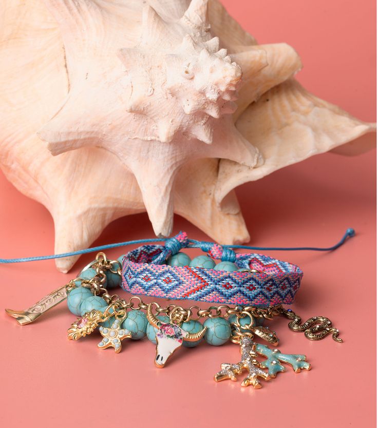 Set of 6 boho western summer charms by Jewelry Made By Me. DIY Coastal Cowgirl looks for jewelry and accessories. Colorful stones and treatments adorn a cactus charm, arrowhead with turquoise bezel stone, studded cowboy hat, floral western boot and cow skull charms, and a lucky horseshoe with starburst. These have a modern breezy beachy take on a classic style. Dimensions: 3/4" long x 1/2" wide, 7/8' long x 5/8" wide, 5/8" long x 3/4" wide, 3/4" long x 5/8" wide, 3/4" long x 7/8" wide, 7/8" long Bohemian Multicolor Jewelry For Souvenir, Multicolor Bohemian Jewelry For Souvenir, Western Blue Jewelry For The Beach, Western Style Summer Jewelry As A Gift, Western Style Jewelry For Summer Gift, Western Style Summer Jewelry For Gift, Turquoise Western Style Summer Jewelry, Handmade Western Beach Jewelry, Adjustable Western Style Summer Jewelry