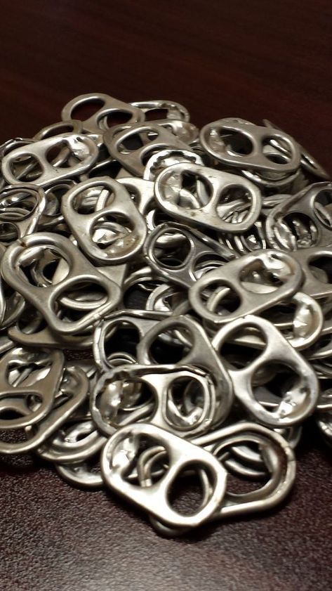 a pile of metal rings sitting on top of a wooden table