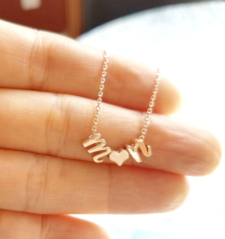 "A beautiful Rose Gold plated Letter and Heart Necklace personalized with your chosen Letter / shiny and minimalist ♡. If you need another color (gold, white gold) please just write a note when you check out. (note to seller box) This necklace has gift box. (individually) Details: - Materials used: Rose Gold plated Brass Chain, approx 5 mm shiny rose gold plated lowercase initials. - Necklace Length is 16\" If you need other length (13~20\") please just write a note when you check out. How to pu Meaningful Rose Gold Necklace For Valentine's Day, Rose Gold Name Necklace For Birthday And Valentine's Day, Customized Rose Gold Charm Necklaces For Anniversary, Dainty Charm Necklace For Valentine's Day Birthday Gift, Customized Rose Gold Charm Necklace For Anniversary, Dainty Charm Necklace For Birthday And Valentine's Day, Custom Name Rose Gold Charm Necklace For Mom, Rose Gold Charm Necklace With Custom Name For Mom, Rose Gold Custom Name Charm Necklace For Mom