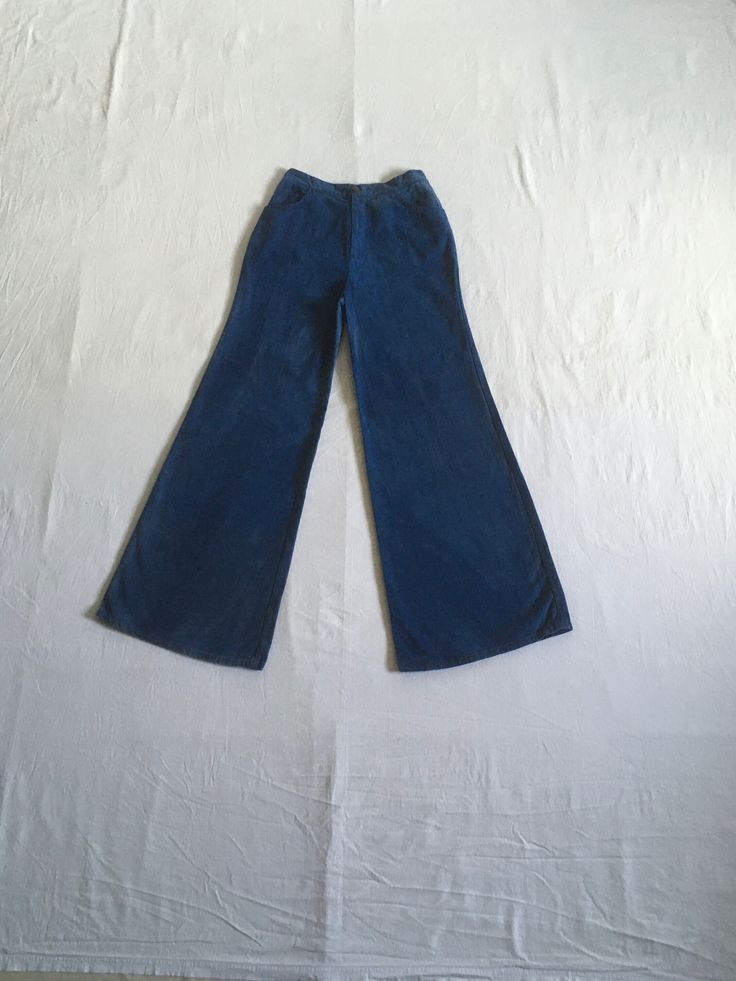 "1970s high waist bell bottom blue jeans cotton zip fly  button snap 2 front pockets authentic age wear aged patina w/fade streaks red, white, blue stitching label size 13/14 (much smaller, see below) measures, lying flat, waist- 13\" to 13 1/2\" with a tug  rise-12\" inseam-31\" hem-13\" hip-21\" total length-42\"     We do not offer returns or refunds unless something is grossly misrepresented. Please contact us within 2 business days of receiving to discuss any possible returns for this reason. We do not offer refunds for your shipping fees. Please feel free to contact us with any questions you may have about an item prior to purchase and we will gladly answer them." Denim Blue Cotton Straight Leg Flares, Blue High Waist Denim Flares, Vintage Washed Blue Bottoms For Fall, Fitted Wide Leg Washed Blue Flare Jeans, Blue Cotton Wide Leg Flares, 70s Inspired Fitted Wide Leg Jeans, Fitted Wide Leg Flare Jeans In Washed Blue, Blue Fitted Cotton Flares, Washed Blue Fitted Wide-leg Flare Jeans