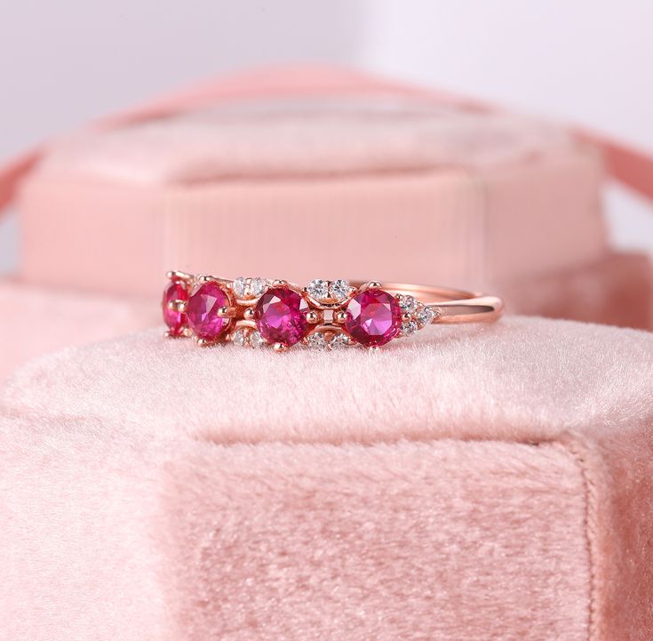 Rose Gold Ruby Band Ring, Ruby Moissanite Band, Natural Ruby & Diamond Eternity Band, Real Ruby Wedding Band, Fuchsia Ruby Anniversary Band ✧･ﾟ: *✧･ﾟ:* Welcome to Charles Davin Jewelry*:･ﾟ･ﾟ✧ Moissanite - a gemstone known to bring in luck in someone's life, the user can give off a look of elegance. You can give your special someone luck whilst showing your love to them. ✶Material: 10K/ 14K/ 18K ✶Main Stone: Natural Ruby; 3.5mm-4 ✶Side Stone: Moissanite; Total: 0.18ct ✶Color: D Colorless ✶Cla Pink Diamond Ring With Diamond Accents For Wedding, Pink Diamond Ring With Accents For Wedding, Valentine's Day Wedding Ruby Ring With Brilliant Cut, Pink Round Cut Ruby Ring For Anniversary, Pink Round Ruby Ring For Wedding, Wedding Lab-created Ruby Ring With Prong Setting, Pink Ruby Ring For Wedding On Valentine's Day, Pink Ruby Ring For Valentine's Day Wedding, Valentine's Day Wedding Ruby Ring With Prong Setting