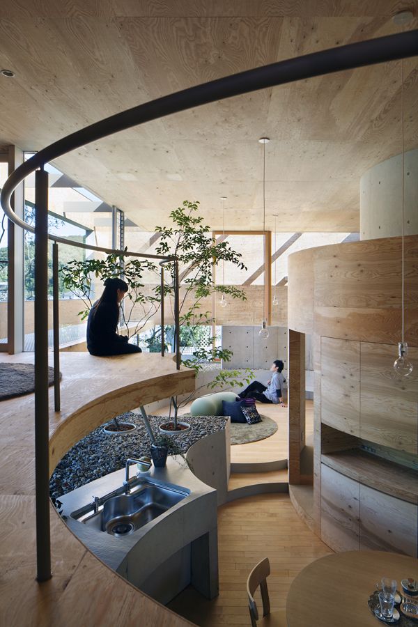 an instagramted post about the design and architecture of a house in japan, with two people sitting on the floor