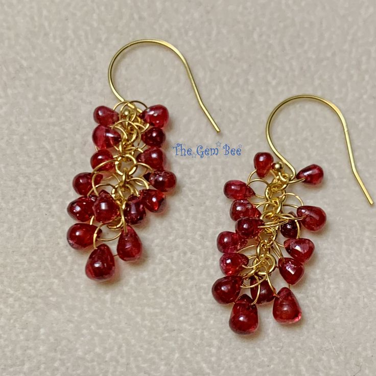 Thank you for coming in!  Spectacular 18K solid yellow gold earrings with Burmese ruby red spinel briolette beads and 18k handmade clusters!   It looks much much nicer in person! DIMENSION: 2.7mmx3.6mm-2.7mmx5mm stones, 1.2 Inch Total Length.   WEIGHT: Appr. 15.80 Carats MATERIAL: 18K Solid Yellow Gold, Natural Red Spinel Handmade Red Briolette Earrings, Red Briolette Earrings With Ear Wire, Grape Earrings, Burmese Ruby, Red Spinel, Yellow Gold Earring, Tube Beads, Rose Gold Color, Natural Red