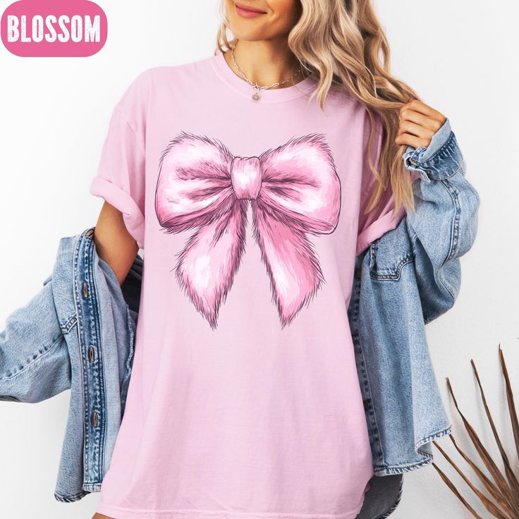 Cozy Pink Bow Coquette on Comfort Colors Tee Elevate your style with this adorable Pink Coquette Bow Comfort Colors Shirt! The delicate bow detail adds a touch of glamour, making it look like it's made from pink fur. Perfect for everyday wear or special occasions. Sizes available. Shop now! Add a whimsical flair to your wardrobe with this Pink Coquette Bow Comfort Colors Shirt! The standout bow detail gives off a luxurious vibe, almost like it's made from pink fur. Made for comfort and style, th Cute Spring Holiday Tops, Cute Tops For Spring Holiday, Cute Holiday Tops For Spring, Cute Long Sleeve Shirt With Funny Print, Spring Holiday Top With Graphic Print, Graphic Print Top For Spring Holiday, Cute Winter Graphic Print Top, Pink Cotton Christmas Tops, Sweet Winter Cotton Tops