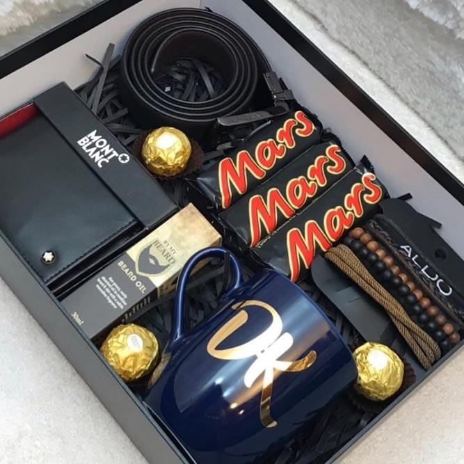 an open box with various items in it on a white surface and the words mars mars mars