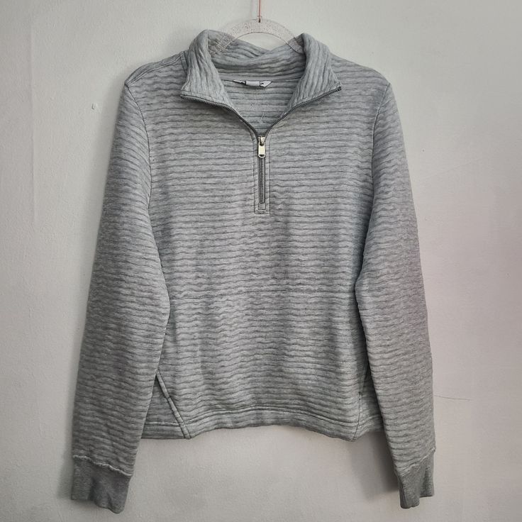 Nwot Size: Xs Color: Gray Super Soft. Pullover. Quater Zipper Closure Kangaroo Front Pocket. Approx Measurements Laying Flat: Pit To Pit: 14" Length: 21" Gray Athleisure Tops With Ribbed Cuffs, Athleisure Gray Tops With Ribbed Cuffs, Sporty Tops With Ribbed Collar And Cozy Fit, Sporty Cozy Fit Tops With Ribbed Collar, Sporty Ribbed Sweatshirt For Loungewear, Sporty Ribbed Winter Tops, Casual Cozy Fit Tops For Sports, Casual Cozy Fit Sports Tops, Athleisure Half-zip Top With Ribbed Collar