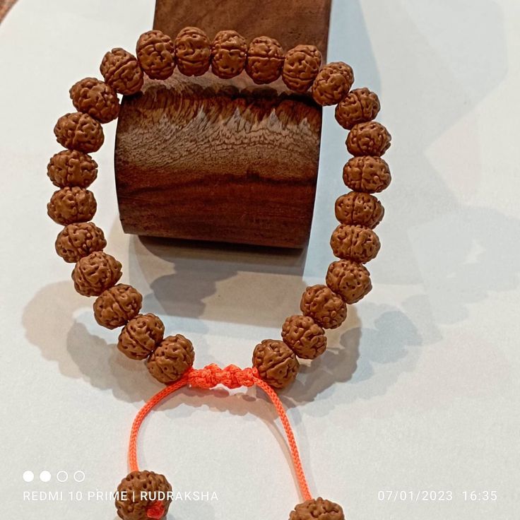 Rudraksha, the most celebrated esoteric accessory of spiritual seekers has been used extensively since time immemorial. This Panchmukhi (Five Faced) Rudraksha Bracelet assists one's spiritual growth. Botanically known as Eliocarpus Ganitrus, Rudraksha are the dried seeds of a tree which grows in select locations of South-East Asia, predominantly in the upper Himalayan mountain. * Rudraksha offered by Harshvi™ is carefully selected and checked for their quality and authenticity. Additionally, the Spiritual Hand-strung Beaded Bracelets For Rituals, Spiritual Beaded Bracelets For Festivals, Adjustable Spiritual Mala For Puja, Adjustable Bracelets For Meditation And Festivals, Adjustable Spiritual Bracelets For Festivals, Traditional 8mm Beads Bracelets For Meditation, Traditional 8mm Bead Bracelets For Meditation, Adjustable Spiritual Jewelry For Puja, Traditional Adjustable Mala For Healing