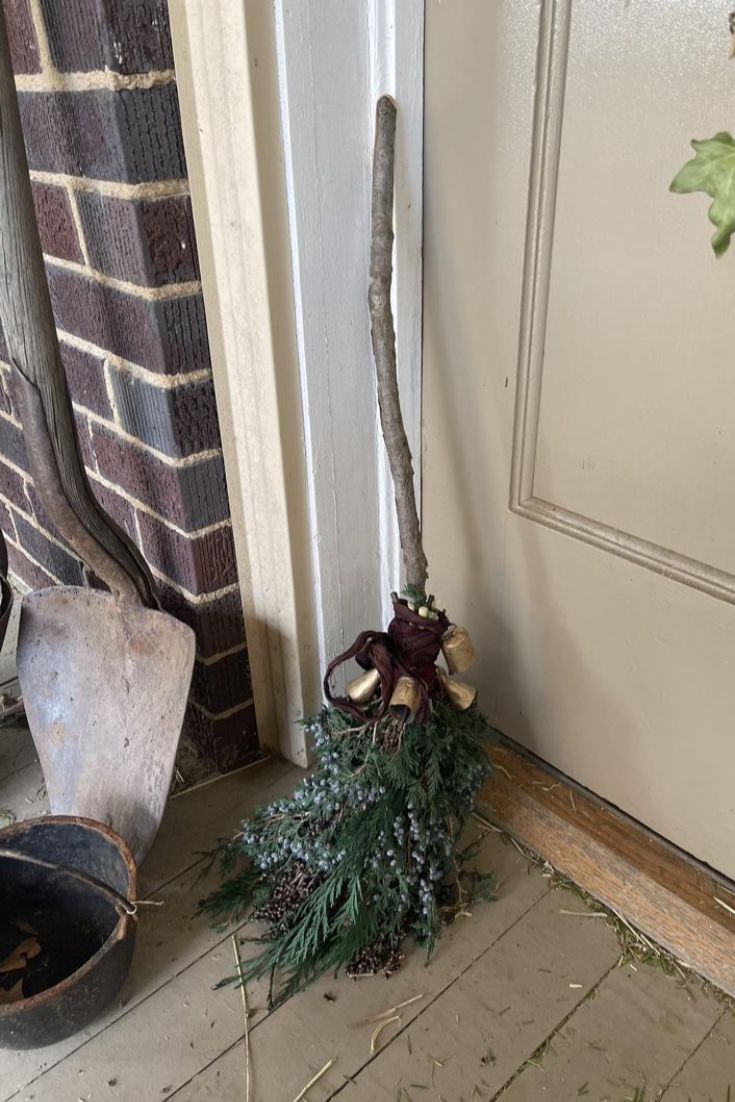 an old shovel sitting on the ground next to a door