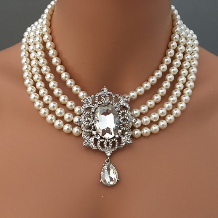 Princess Wedding Necklace with Rhinestone Brooch and 4 multi strands of Swarovski Pearls Bridal wedding jewelry mother of the bride gift This Princess Bridal Wedding Necklace with Rhinestone Brooch is stunning on with tons of Elegant Glamour! The Pear Shaped Crystal Rhinestone Brooch focal is worn in the front in a sexy cascade. An Elegant Statement Necklace for any special occasion, it has Four 4 multi strands of Swarovski Crystal Pearls (shown in White), and includes the Brooch embellishment s Elegant Statement Necklace, Pearl Necklace Vintage, Vintage Princess, Necklace Extender, Wedding Bridal Jewellery, Rhinestone Brooches, Bridal Pearls, Swarovski Pearls, Wedding Jewelry Sets