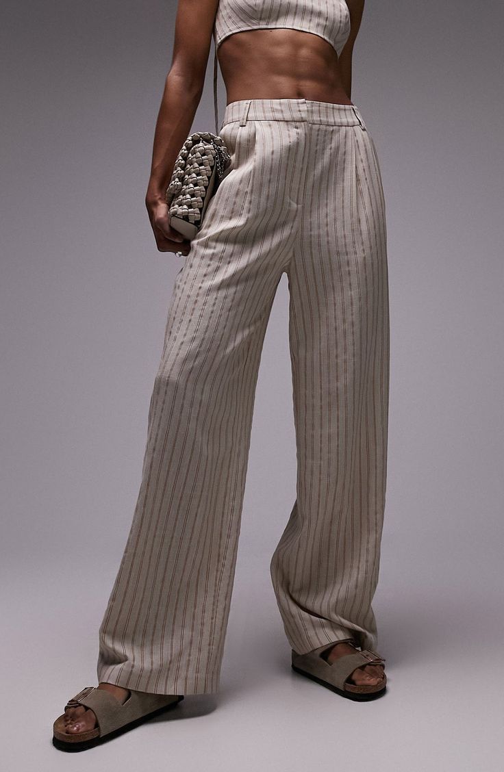 A classic for the workday, these wide-leg pants feature a timeless stripe pattern and pleats to enhance the flowy fit. Zip fly with hook-and-bar closure Front slant pockets; back button-welt pocket 80% viscose, 13% linen, 7% polyester Machine wash, line dry Imported Elegant Striped Pants For Summer, Elegant Pinstripe Pants For Summer, Classic Bottoms With Vertical Stripes For Summer, Classic Vertical Stripes Bottoms For Summer, Elegant Pinstripe Bottoms For Summer, Elegant Striped Wide Leg Pants For Summer, Elegant Summer Pants With Vertical Stripes, Elegant Summer Pinstripe Pants, Chic Wide Leg Pants With Vertical Stripes For Summer