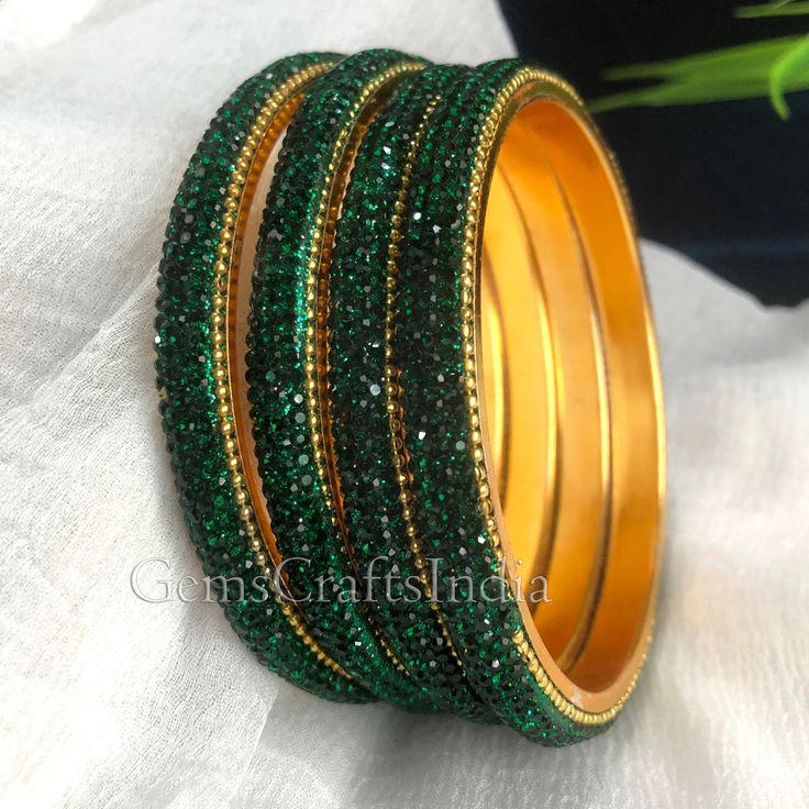 BEAUTIFUL GOLD PLATED BANGLE *  Main Color : Green * Skin Friendly : This Product does not contain harmful constituents. Anti-allergic safe for Skin. * Quality : Made from Premium Quality Material. This Product assures to remain in its Original Glory even after several usages.     . Actual Images of item are shown above, Please be aware of the actual colors may vary from the color shown on your screen, as monitor    settings may vary from individual to individual. . Welcome to Our Etsy Store! We Green Bangles Set, Bridal Bangles Wedding, Gold Bangles Set, Antique Gold Bangles, Green Bangles, Colorful Bangles, Kundan Bangles, Gold Bangle Set, Indian Fashion Jewellery