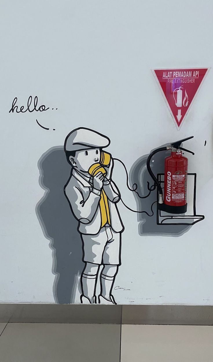 The boy speaks to the paper cup, but he listens to himself on the other end of the line.  What a silly way to communicate!

Fire extinguisher marking Wall Art Diy Paint, Coffee Shops Interior, Fire Extinguishers, Make Believe, Line At, Fire Extinguisher, Make Things, Paper Cup, The Boy