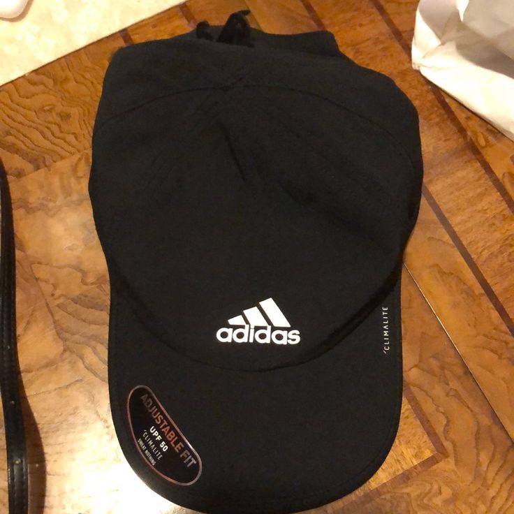 Adidas Men's And Women's Hat Adidas Black Baseball Cap For Sports, Adidas Black Visor Hat, Black Adidas Visor Hat, Adidas Black Hat With Curved Brim, Adidas Casual Black Hat, Adidas Black Baseball Cap With Curved Brim, Adidas Casual Flat Bill Hat, Black Sports Hats, One Size Fits Most, Adidas Hat