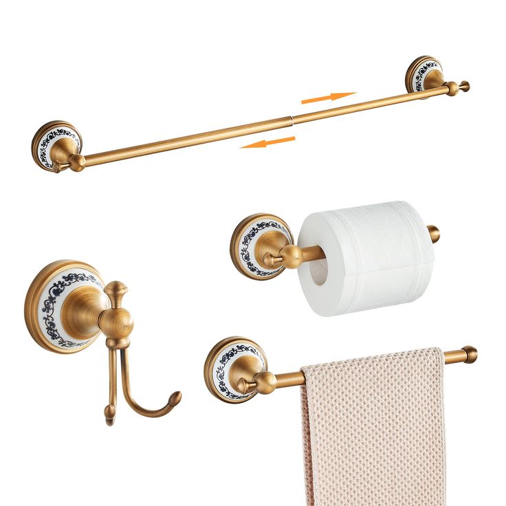 a bathroom set with gold fixtures and toilet paper