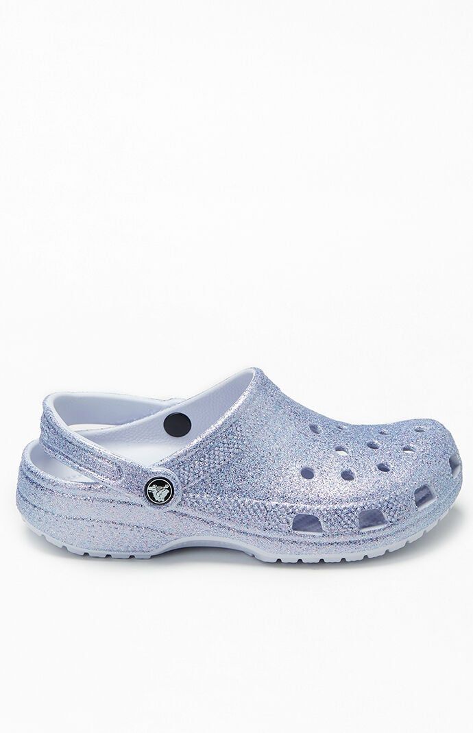 Crocs will keep you comfy this season in their Kids Glitter Classic Clogs. These slip-on shoes have an incredibly light construction and a pivoting heel strap for a secure fit.All-over glitter finishPivoting heel strapLight constructionVentilation holesIconic Crocs Comfort™ Crocs Kids Glitter Classic Clogs - Multicolor size 3 Kids Glitter Crocs, 5 Kids, 4 Kids, Trending Gifts, Strap Heels, Christmas List, Pacsun, On Shoes, Slip On Shoes