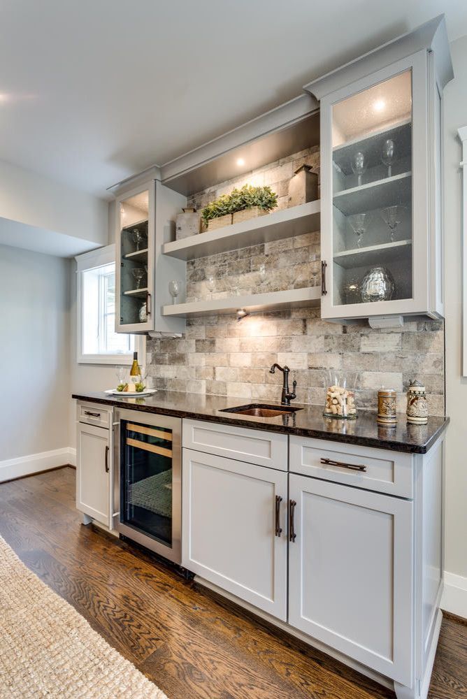 a kitchen with an oven, sink and cabinets in the middle of it is shown