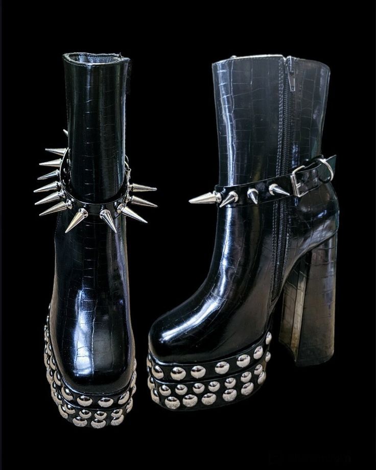 This listing is for this pair of black goth/punk style spiked 6 inches high heel women's boots .available in uk women's size 5  Made with shiny patern high quality pu leather comes with 28mm spike removable belt . Size: uk women's size 5 Material: EVA Style: Punk / Goth Front Height: 45mm Back Heel height: 6 inches  The boots itself is not manufactured by me . I did the modifications with metal Embellishments and spikes of my choice . SHIPPING BY INTERNATIONAL AIRMAIL - DOES NOT PROVIDE TRACKING Punk Style High Ankle Platform Boots, High-top Spiked Alternative Platform Boots, Alternative High-top Spiked Platform Boots, Edgy Platform Boots For Halloween Streetwear, Edgy Knee-high Boots For Streetwear, Gothic Boots With Rivets For Cosplay, Punk Style Knee-high Platform Moto Boots, Edgy Black Spiked Platform Boots, Punk Style Platform Heeled Boots With Round Toe