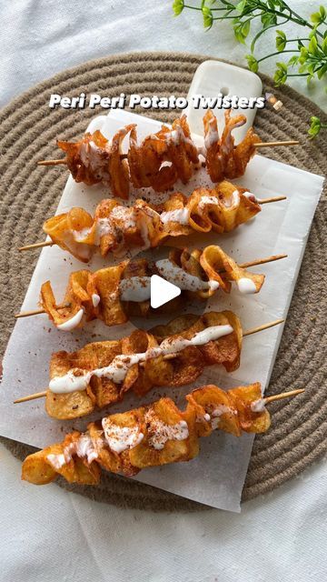 several skewers of food sitting on top of a plate