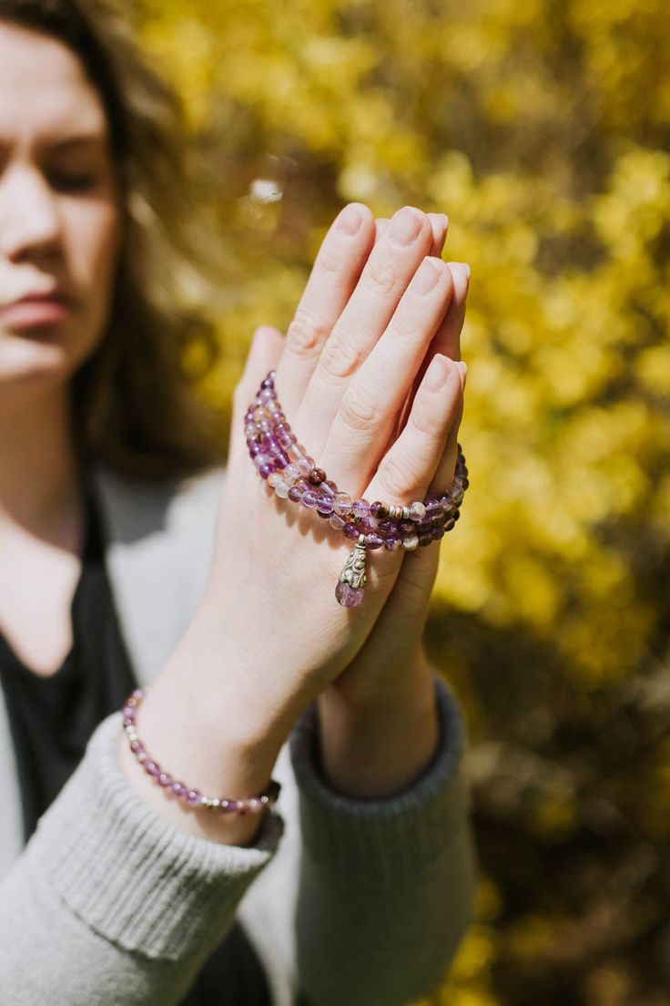 We are so excited to introduce our DharmaShop exclusive Super Seven Mala! Hand strung here in Detroit with genuine Super Seven beads from Brazil and a faceted Amethyst gemstone pendant from Nepal. Super Seven is a rare mineral made from a blend of seven crystals including: Amethyst, Clear Quartz, Smoky Quartz, Cacoxenite, Rutile, Geothite, and Lepidocrocite. This incredibly powerful stone combines the healing properties of all seven crystals! Super Seven is believed to energize and heal all seve Spiritual Natural Gemstones For Meditation, Spiritual Faceted Beads Crystal Bracelet For Jewelry Making, Spiritual Faceted Crystal Bracelet Gift, Spiritual Amethyst Crystal Bracelet, Faceted Amethyst Spiritual Gemstone, Spiritual Hand-strung Amethyst Jewelry, Faceted Amethyst Beads, Faceted Round Amethyst Beads, Round Faceted Amethyst Beads