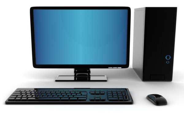 a computer with a keyboard and mouse on a white surface next to a black monitor