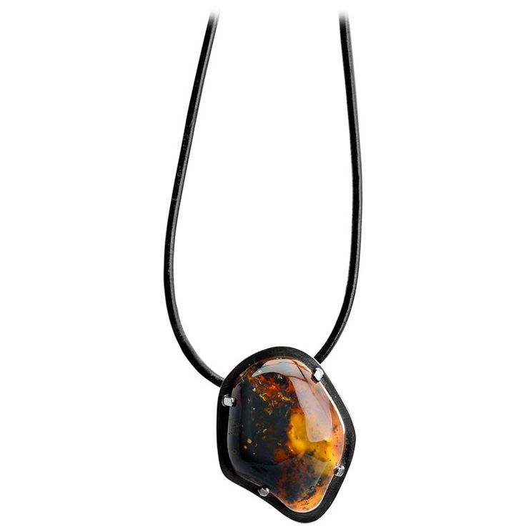 Famous Polish Designer Mariusz Gliwinski is known for his exquisite amber stones and jewelry that are works of art! Stones: Baltic Amber Length: Necklace is approx. 21" in length Width: Pendant approx. 2 1/4" long x 1 3/4" wide and is approx. 1/2" thick (depth) Material: .925 Silver, Leather Collar Made in: Poland Silver Statement Necklace, Silver Necklace Statement, Length Necklace, Amber Stone, Leather Collar, Baltic Amber, Works Of Art, Poland, 925 Silver