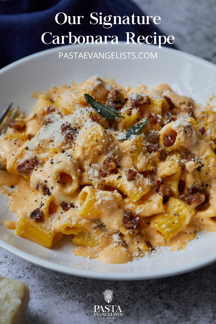 a white plate topped with pasta covered in sauce