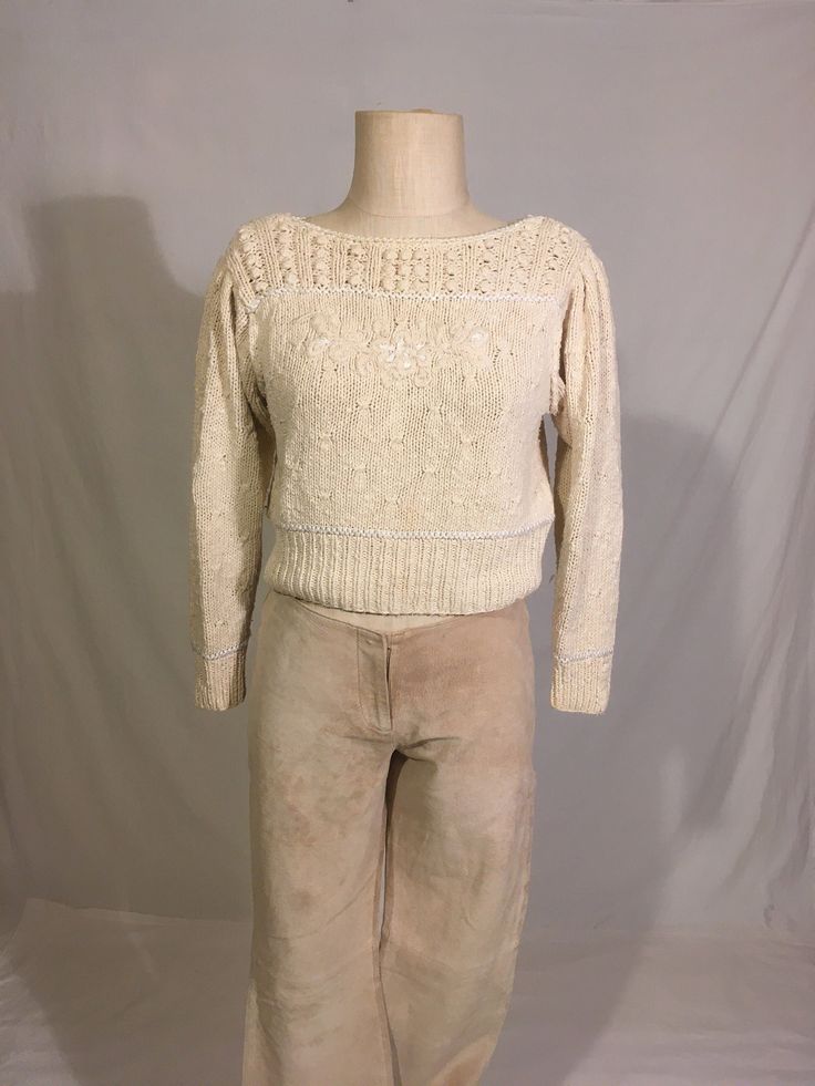 "vintage 1980s pullover sweater Liz Claiborne Collection knitted by hand made in Korea 63% silk 32% cotton 5% rayon ivory white shoulder pads puff sleeve long sleeve boat neck wide waist band good vintage condition, light wear, light pilling/thread shoots -see photos label size petite P, see below measures, lying flat, shoulder-16 1/2\" sleeve-19 1/2\" chest-17 1/2\" length-17\"" Fitted Cotton Cream Sweater, Fitted Cream Cotton Sweater, Vintage Cream Knit Tops, Vintage Fitted Knit Sweater, Cream Fitted Cropped Sweater With Crew Neck, Cream Cropped Fitted Sweater With Crew Neck, Vintage Cream Knit Sweater, Vintage Beige Cotton Sweater, Beige Cotton Vintage Sweater