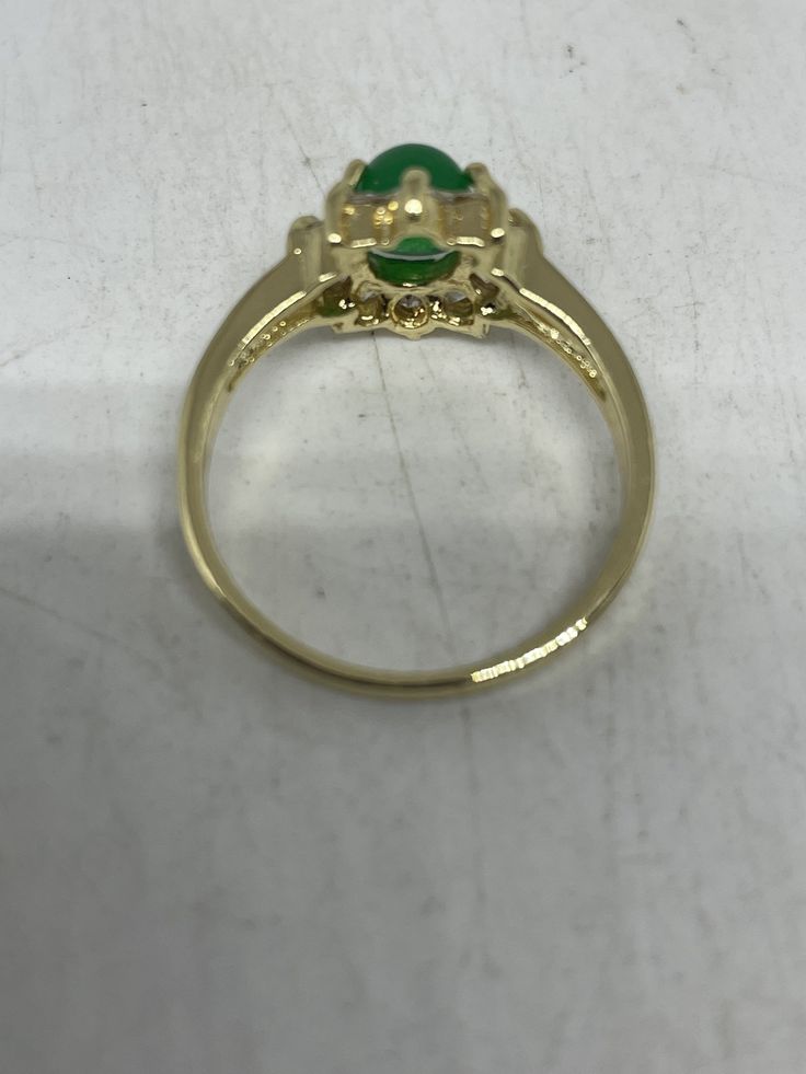 Vintage Lucky Green Nephrite Jade Gold Filled Cocktail Ring Large green nephrite jade gold filled Vintage ring, does not tarnish Size 6, 7, 7.5, 8, 8.75, 9.5 All rings are shipped free in the US in a nice gift box. Check out our over a THOUSAND great reviews Engraving is $4 per letter and is not always perfect depending on the piece. It can take a few days if the jeweler is busy. This is payable to Paypal Judithsltd@gmail.com Gold Jade Emerald Ring, Gold Emerald Ring For May Birthstone, Oval Shape, Green Emerald Hallmarked Cluster Ring, Fine Jewelry Gold Jade Rings, Gold Jade Rings In Fine Jewelry Style, Fine Jewelry Gold Rings With Jade, Green Emerald Cluster Ring With Hallmark, Formal Gold Jade Rings, Oval Green Gemstone Cluster Ring