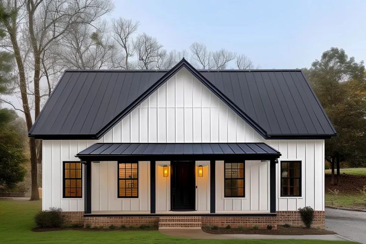 a white house with black roof and windows