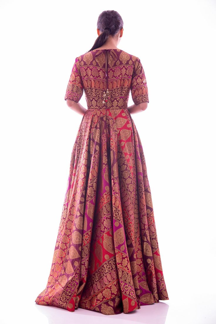 Wine and deep red shade anarkali with all-over woven motifs, with pleats and flare. Paired with a banarasi georgette dupatta in deep red.
Components:2
Woven
Neckline:U-neck
Sleeve Length:Elbow
Fabric:Anarkali: Brocade; Dupatta: Banarasi Georgette
Color:Red, Purple
Tri color, floor length anarkali
Tiny tassels on the neck and sleeves hem
Fringed tassels on dupatta border - Aza Fashions Brocade Anarkali, Brocade Dupatta, Red Anarkali, Dupatta Border, Floor Length Anarkali, Color Floor, Georgette Dupatta, U Neck, Tassel Fringe