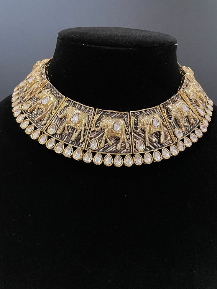 This beautiful piece is handcrafted to perfection and comes in 3 gorgeous colors. It's perfect to add a traditional touch to any event and is so unique with its intricate design. The necklace comes with a matching set of earrings. Bollywood Style Jewelry Sets With Tilla For Rituals, Metal Kundan Temple Jewelry Necklace, Bollywood Brass Necklace With Intricate Design, Bollywood Brass Necklaces With Intricate Design, Bollywood Style Brass Necklace With Intricate Design, Festive Meenakari Temple Necklace In Metal, Diwali Kundan Necklace For Rituals, Metal Kundan Necklace With Tilla For Festivals, Festive Kundan Necklace With Tilla