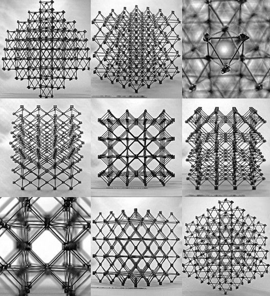 many different shapes and sizes of wire mesh structures in black and white, with shadows coming from them