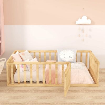 a baby crib in a pink and white nursery